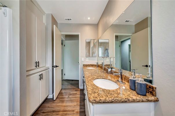 Bathroom, Dual Sink Vanities, Interior, Recessed Lighting, Wood Texture Flooring