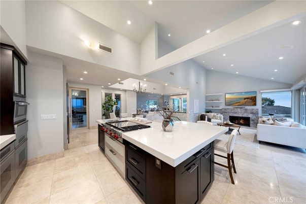 Chandelier, Dining room, Fireplace, Interior, Kitchen, Living room, Pendant Lights, Recessed Lighting, Stainless Steel Appliances