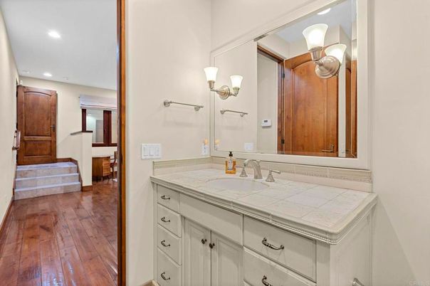 Bathroom, Interior, Recessed Lighting, Tile Countertops, Wood Texture Flooring