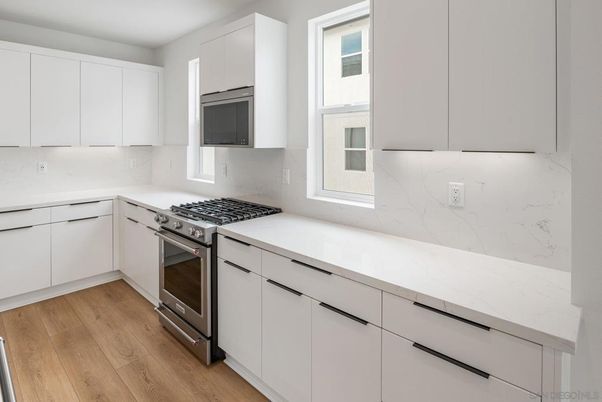 Interior, Kitchen, Marble Walls, Stainless Steel Appliances, Wood Texture Flooring