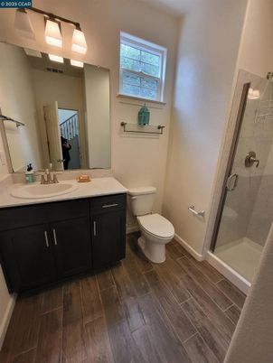 Bathroom, Dual Sink Vanities, Glass Shower, Interior, Wood Texture Flooring