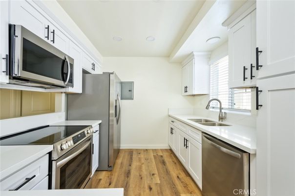 Interior, Kitchen, Recessed Lighting, Stainless Steel Appliances, Wood Texture Flooring