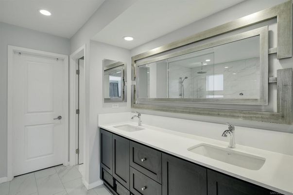 Bathroom, Dual Sink Vanities, Glass Shower, Interior, Marble, Marble Walls, Recessed Lighting