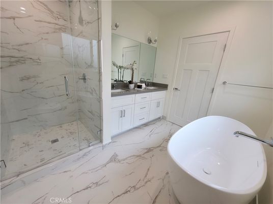 Bathroom, Dual Sink Vanities, Free Standing Baths, Glass Shower, Interior, Marble, Marble Walls