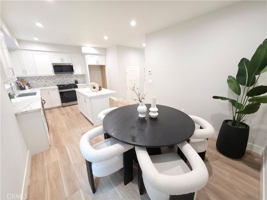 Dining room, Interior, Kitchen, Recessed Lighting, Stainless Steel Appliances, Wood Texture Flooring