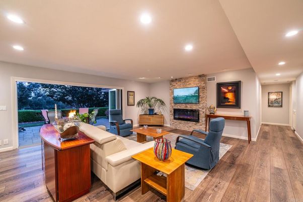 Fireplace, Interior, Living room, Recessed Lighting, Stone Walls, Wood Texture Flooring