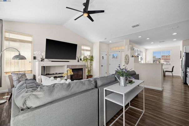 Dining room, Fireplace, Interior, Living room, Recessed Lighting, Wood Texture Flooring