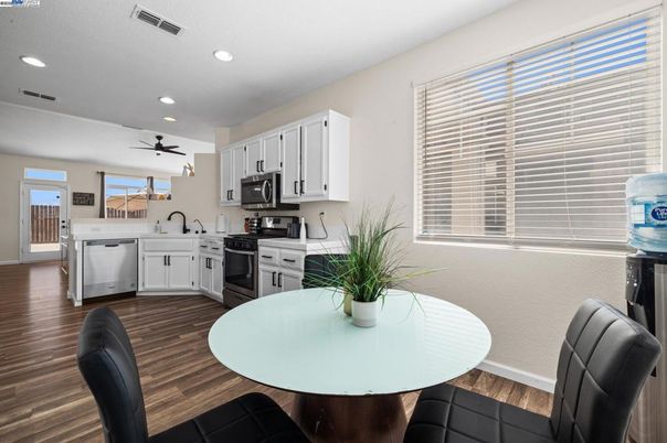 Dining room, Interior, Kitchen, Recessed Lighting, Stainless Steel Appliances, Wood Texture Flooring