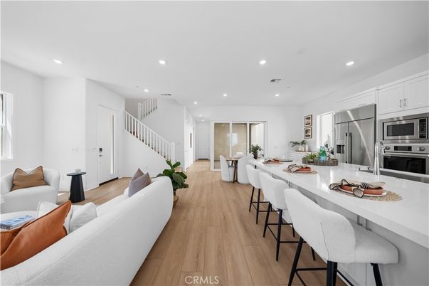 Dining room, Interior, Kitchen, Living room, Recessed Lighting, Stainless Steel Appliances, Wood Texture Flooring