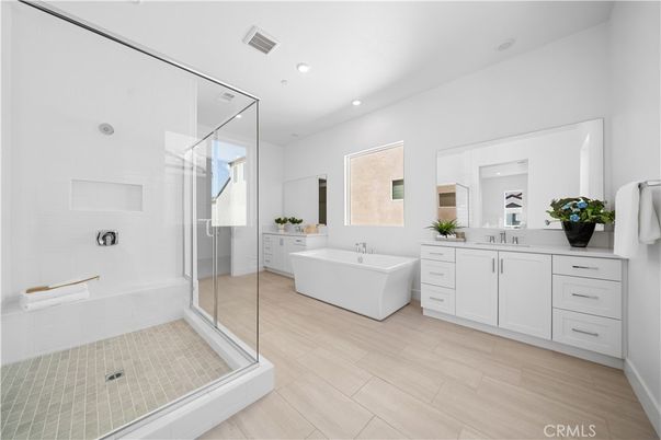 Bathroom, Dual Sink Vanities, Free Standing Baths, Glass Shower, Interior, Recessed Lighting, Wood Texture Flooring