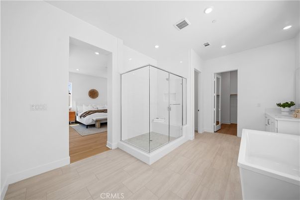 Bathroom, Bedroom, Free Standing Baths, Glass Shower, Interior, Recessed Lighting, Wood Texture Flooring