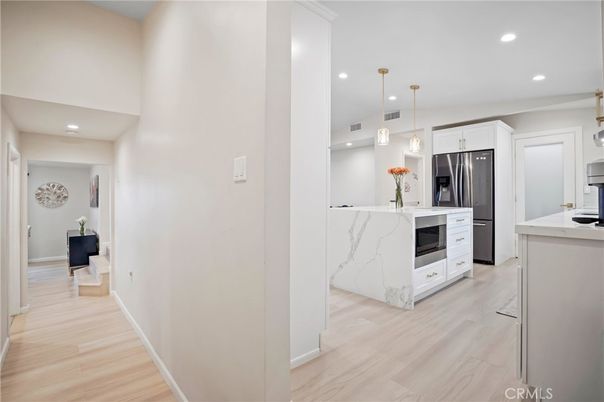 Interior, Kitchen, Marble Walls, Pendant Lights, Recessed Lighting, Stainless Steel Appliances, Wood Texture Flooring