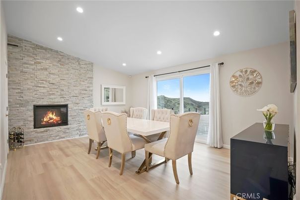 Dining room, Fireplace, Interior, Recessed Lighting, Stone Walls, Wood Texture Flooring