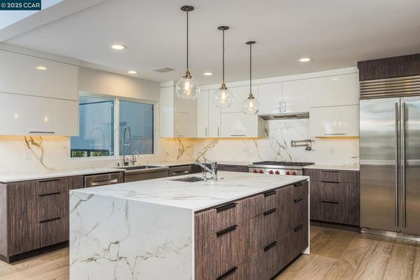 Interior, Kitchen, Marble Walls, Pendant Lights, Recessed Lighting, Stainless Steel Appliances, Wood Texture Flooring
