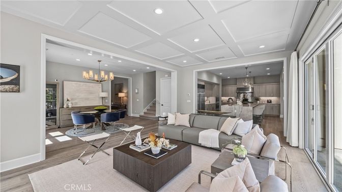 Chandelier, Dining room, Interior, Kitchen, Living room, Pendant Lights, Recessed Lighting, Stainless Steel Appliances, Wood Texture Flooring