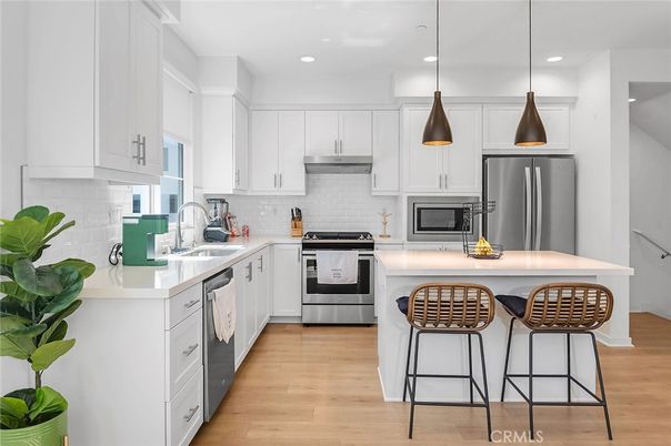 Interior, Kitchen, Pendant Lights, Recessed Lighting, Stainless Steel Appliances, Wood Texture Flooring