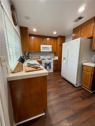 Interior, Kitchen, Recessed Lighting, Tile Countertops, Wood Texture Flooring