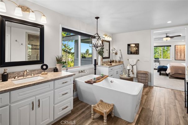 Bathroom, Dual Sink Vanities, Free Standing Baths, Interior, Pendant Lights, Recessed Lighting, Wood Texture Flooring
