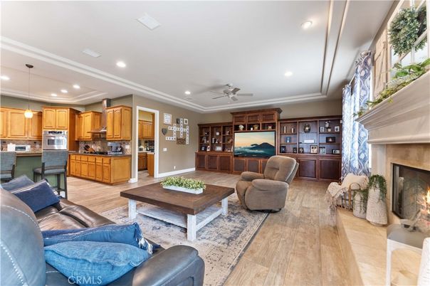 Fireplace, Interior, Kitchen, Living room, Pendant Lights, Recessed Lighting, Stainless Steel Appliances, Wood Texture Flooring