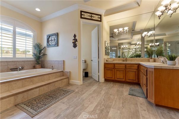 Bathroom, Dual Sink Vanities, Interior, Recessed Lighting, Tile Countertops, Wood Texture Flooring