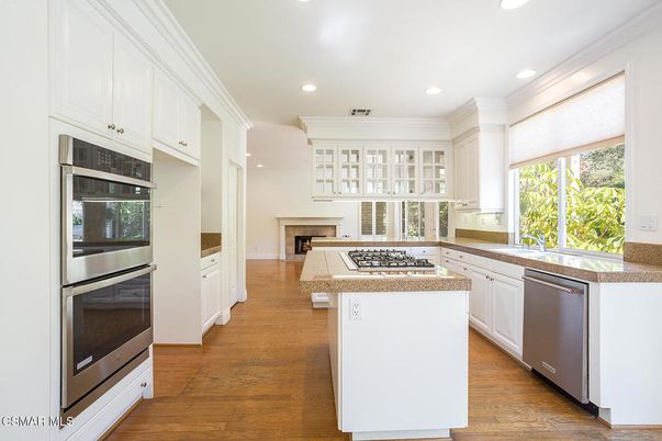 Fireplace, Interior, Kitchen, Recessed Lighting, Stainless Steel Appliances, Wood Texture Flooring