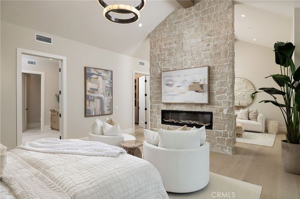 Bedroom, Fireplace, Interior, Living room, Pendant Lights, Recessed Lighting, Stone Walls, Wood Texture Flooring