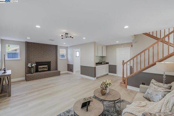 Fireplace, Interior, Living room, Recessed Lighting, Stone Walls, Wood Texture Flooring