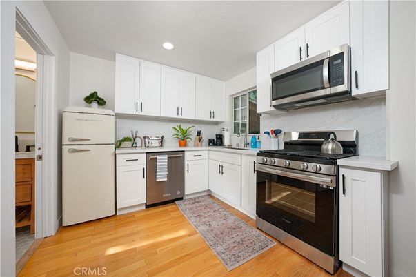 Interior, Kitchen, Recessed Lighting, Stainless Steel Appliances, Wood Texture Flooring