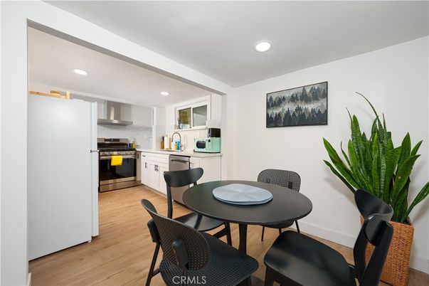Dining room, Interior, Kitchen, Recessed Lighting, Stainless Steel Appliances, Wood Texture Flooring