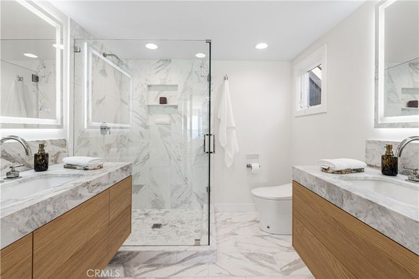 Bathroom, Dual Sink Vanities, Glass Shower, Interior, Marble, Marble Walls, Recessed Lighting