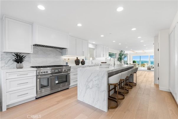 Interior, Kitchen, Marble Walls, Recessed Lighting, Stainless Steel Appliances, Water, Wood Texture Flooring