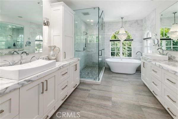 Bathroom, Dual Sink Vanities, Free Standing Baths, Glass Shower, Interior, Marble Walls, Pendant Lights, Recessed Lighting