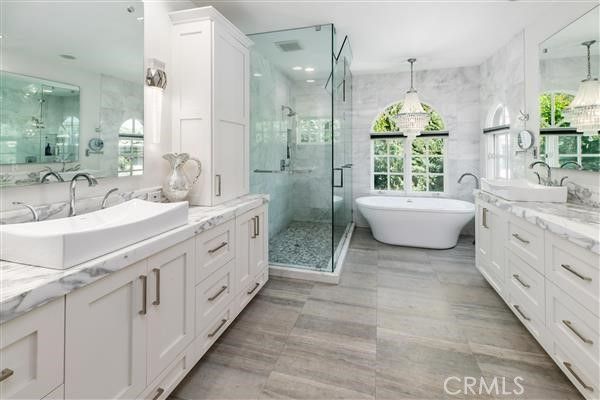 Bathroom, Dual Sink Vanities, Free Standing Baths, Glass Shower, Interior, Marble Walls, Pendant Lights, Recessed Lighting