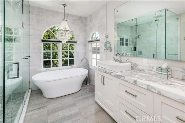 Bathroom, Chandelier, Dual Sink Vanities, Free Standing Baths, Glass Shower, Interior, Marble, Marble Walls, Pendant Lights