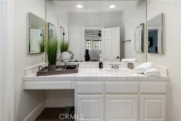 Bathroom, Dual Sink Vanities, Interior, Recessed Lighting, Tile Countertops, Wood Texture Flooring