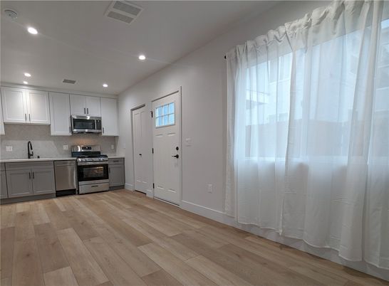 Interior, Kitchen, Recessed Lighting, Stainless Steel Appliances, Wood Texture Flooring