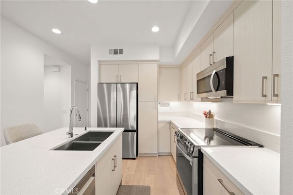 Interior, Kitchen, Recessed Lighting, Stainless Steel Appliances, Wood Texture Flooring
