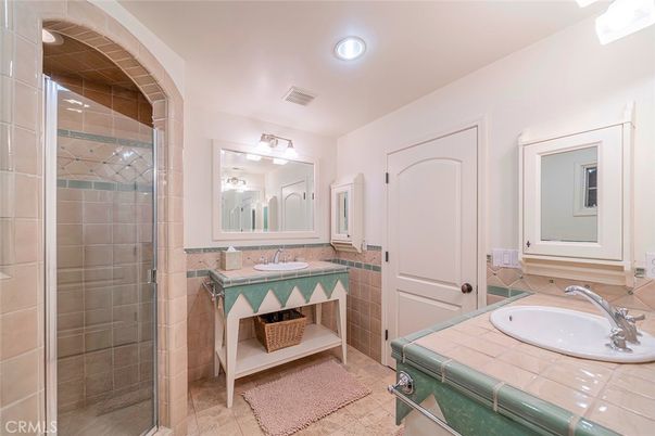 Bathroom, Dual Sink Vanities, Glass Shower, Interior, Recessed Lighting, Tile Countertops
