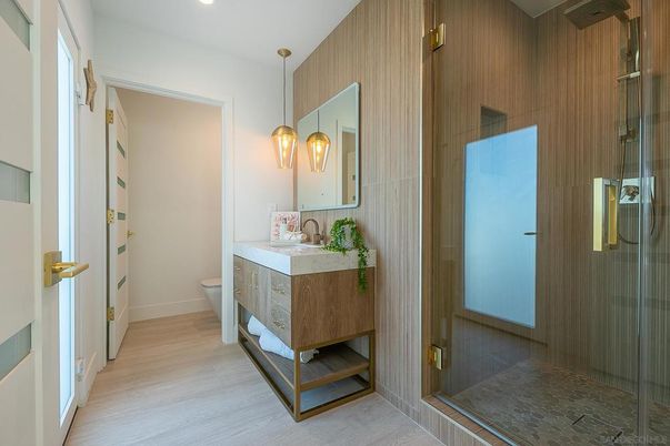 Bathroom, Glass Shower, Interior, Pendant Lights, Recessed Lighting, Wood Texture Flooring