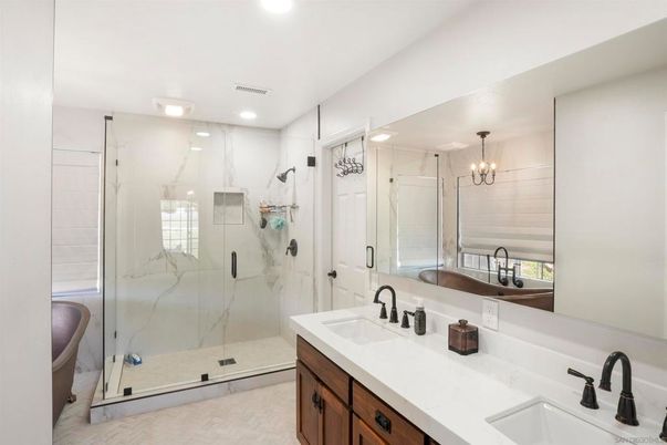 Bathroom, Chandelier, Dual Sink Vanities, Glass Shower, Interior, Marble Walls, Recessed Lighting