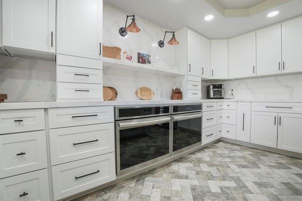 Interior, Kitchen, Marble Walls, Recessed Lighting, Stainless Steel Appliances