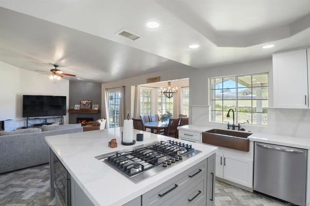 Chandelier, Dining room, Fireplace, Interior, Kitchen, Living room, Recessed Lighting, Stainless Steel Appliances