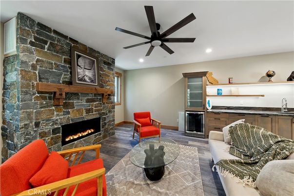Fireplace, Interior, Living room, Recessed Lighting, Stone Walls, Wood Texture Flooring