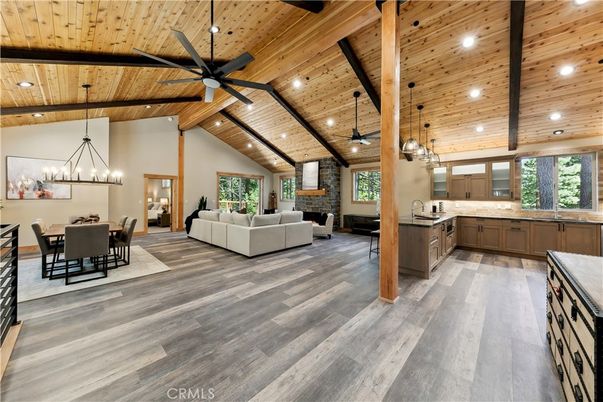 Chandelier, Dining room, Fireplace, Interior, Kitchen, Living room, Pendant Lights, Recessed Lighting, Stone Walls, Wooden Beams, Wooden Ceilings, Wood Texture Flooring
