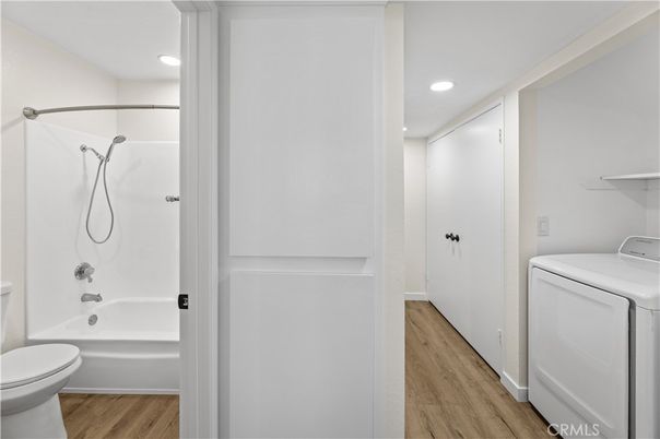 Bathroom, Interior, Recessed Lighting, Washer, Wood Texture Flooring