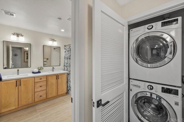 Bathroom, Dual Sink Vanities, Interior, Recessed Lighting, Utility Closets, Washer