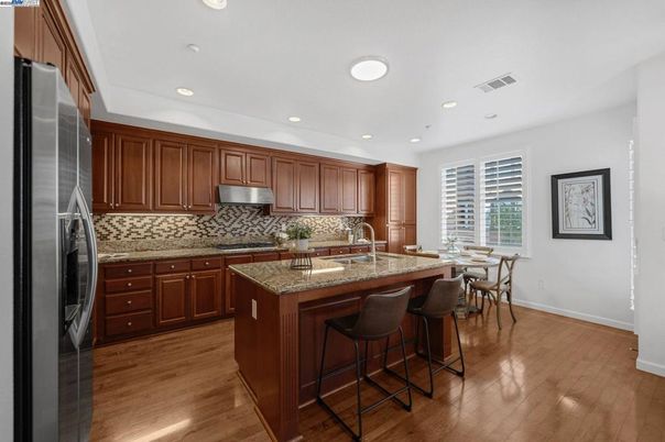 Dining room, Interior, Kitchen, Recessed Lighting, Stainless Steel Appliances, Wood Texture Flooring