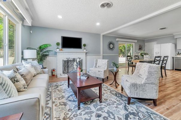 Dining room, Fireplace, Interior, Living room, Recessed Lighting, Wood Texture Flooring