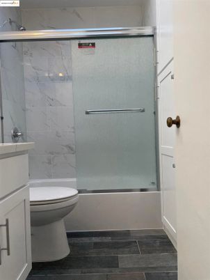 Bathroom, Glass Shower, Interior, Marble Walls, Wood Texture Flooring