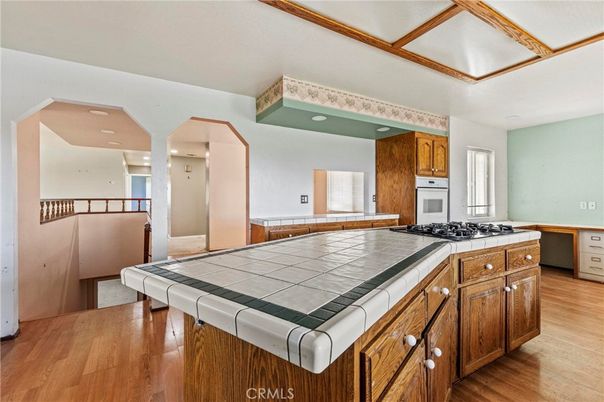 Interior, Kitchen, Recessed Lighting, Tile Countertops, Wood Texture Flooring